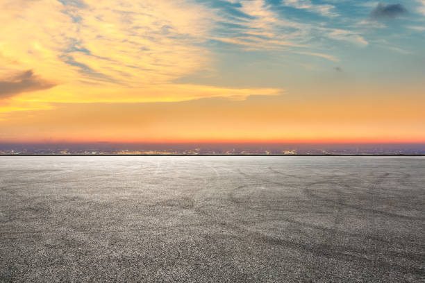 istock Empty asphalt ground and city skyline with beautiful clouds at sunset 1133142820