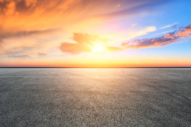 istock Empty asphalt ground and city skyline with beautiful clouds at sunset 1133143507