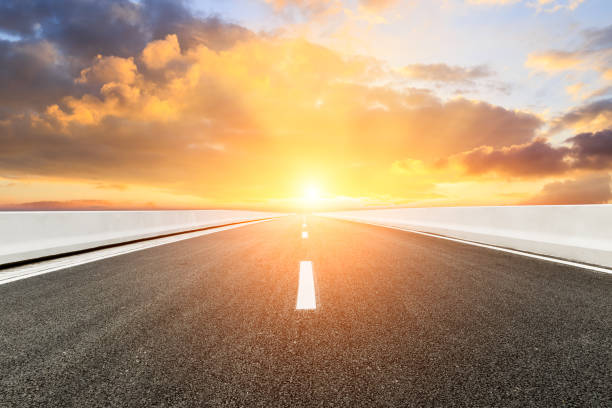 istock Asphalt road and beautiful colorful clouds at sunset 1133143554