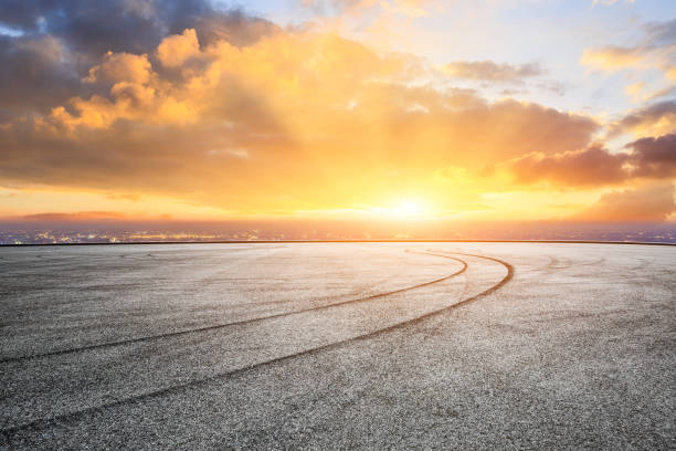 istock Empty asphalt ground and city skyline with beautiful clouds at sunset 1133143656