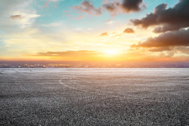 istock Empty asphalt ground and city skyline with beautiful clouds at sunset 1133144146