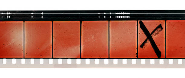 old and blank 16mm film movie strip with empty frames on white stock photo