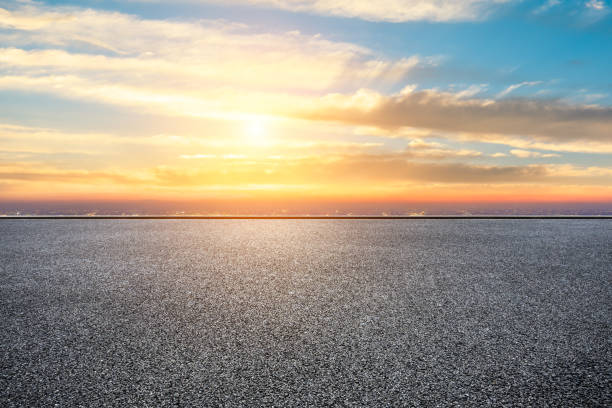 istock Empty asphalt ground and city skyline with clouds at sunset 1133144831