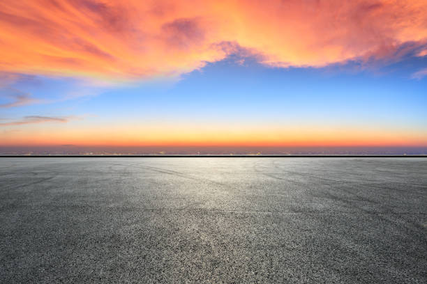 istock Empty asphalt ground and city skyline with beautiful clouds at sunset 1133144857