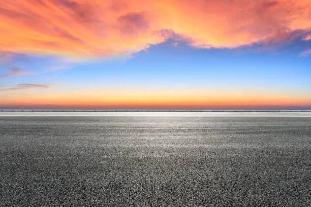 istock Asphalt road and beautiful colorful clouds at sunset 1133144957