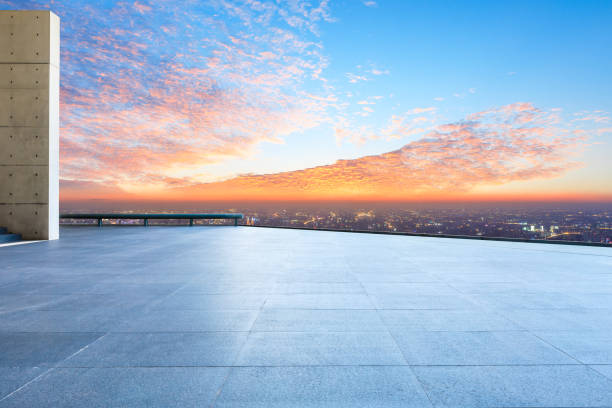 istock Empty floor and modern city skyline with beautiful colorful clouds at sunset 1133146106