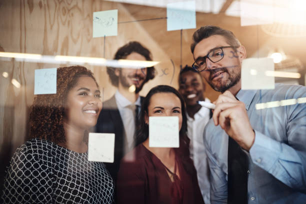 istock Putting new ideas up on the wall 1133146178