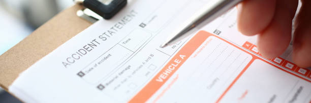 istock Male insurer hand hold silver pen an accident 1133146280