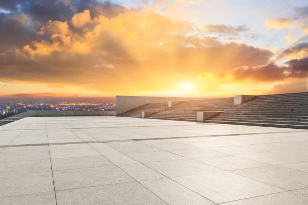istock Empty floor and modern city skyline with beautiful colorful clouds at sunset 1133146967
