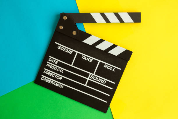 istock Flat lay of clapperboard against multicolored background. 1133151218