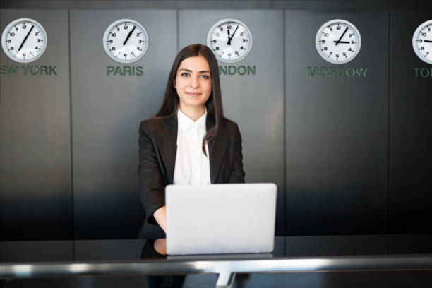 istock Young beautiful hotel receptionist at workplace looking at camera 1133152267