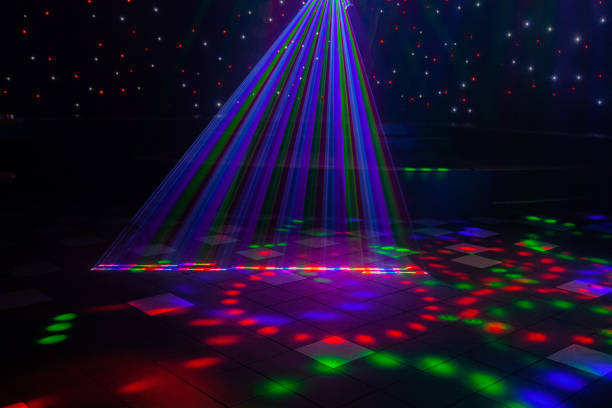 Night club laser lights making patterns on the dance floor in Australia with a stage setting in the background. Inspiration for Mardi Gras or nightlcub promotions. Close up of night club laser lights series from Australian gay bar and nightclub with a stage setting in the background. dance floor stock pictures, royalty-free photos & images