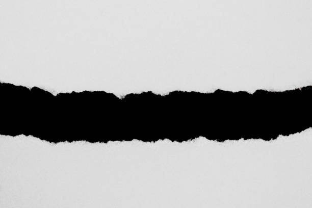 istock White ripped paper isolated on black background with copy space 1133152818