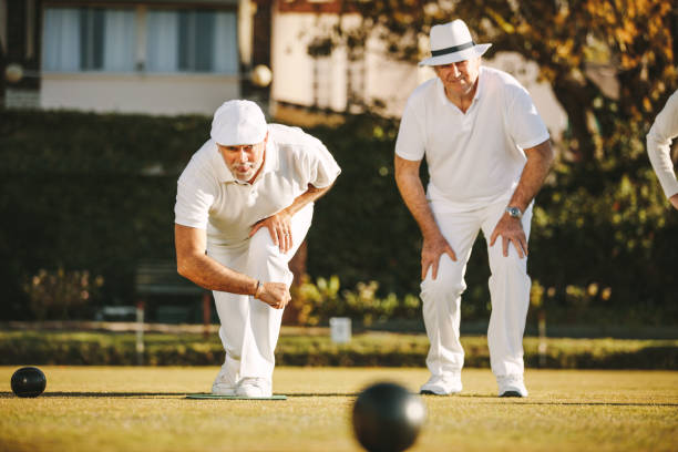 istock Old men playing a game of boules 1133154419