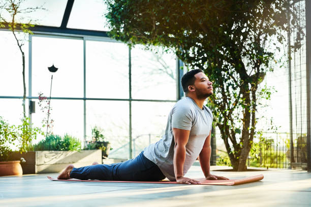 Sporty male in Urdhva Mukha Shvanasana pose