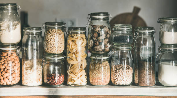 istock Grains, cereals, nuts, dry fruit, flour, pasta over kitchen counter 1133156052