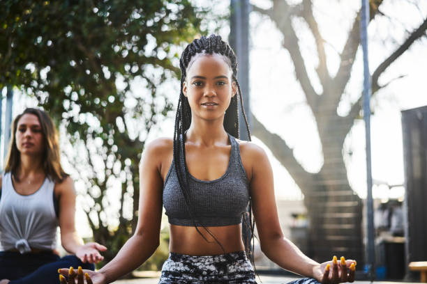 istock Portrait of young woman practicing lotus position 1133156065