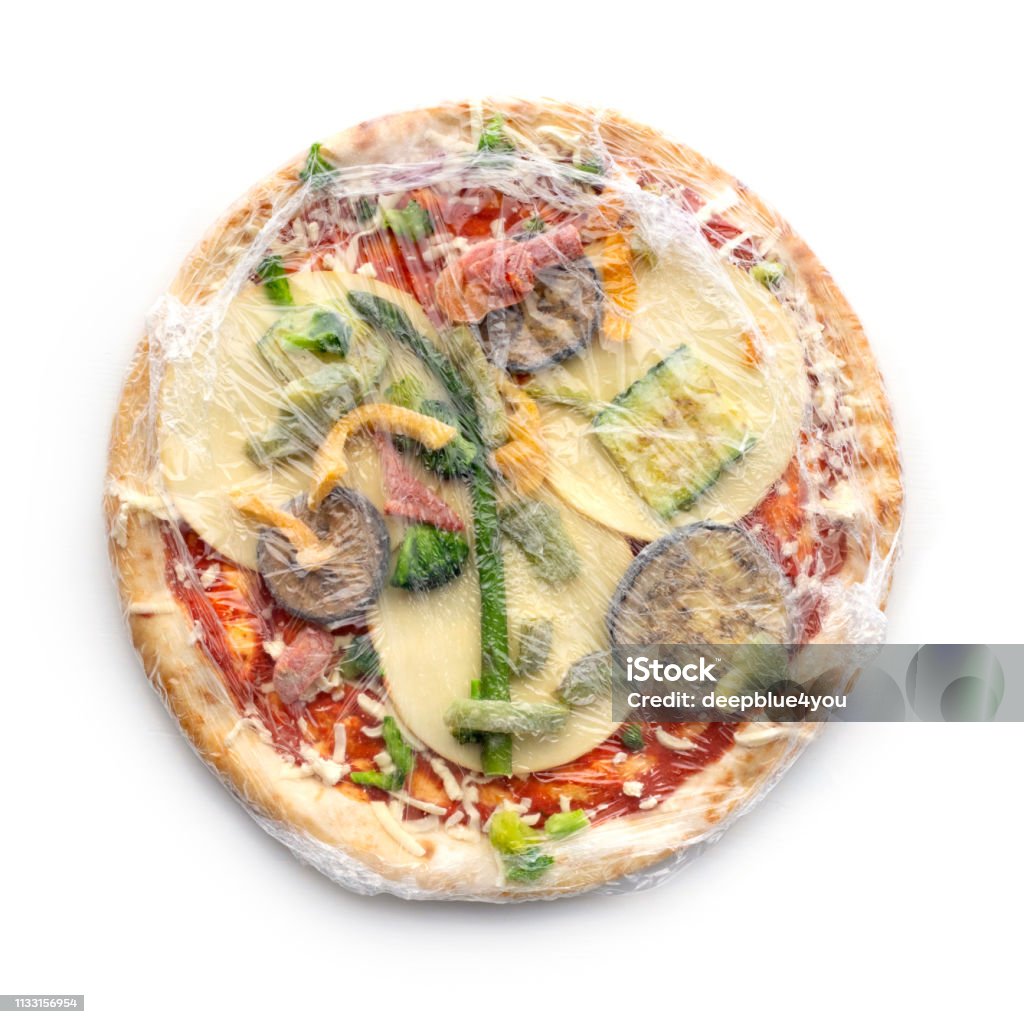 Frozen pizza in foil on white background Frozen pizza in foil Frozen Stock Photo