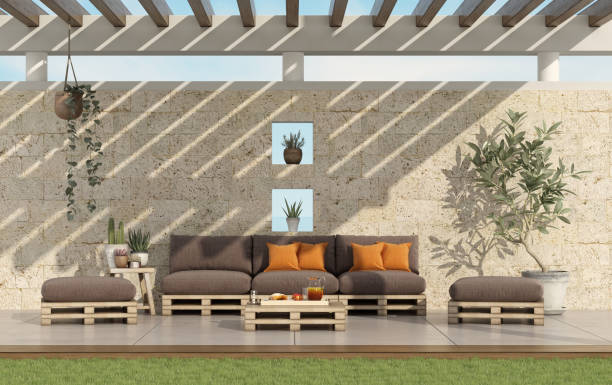 istock Garden with pallet sofa with stone wall on background 1133157214