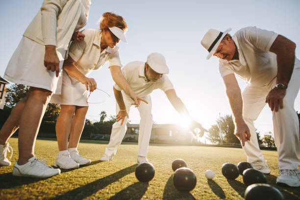 istock Senior people playing boules in a park 1133157397