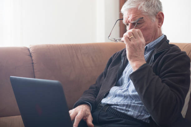 istock Senior Man Using Eyeglasses When Looking at Computer Monitor 1133157439