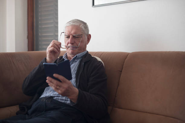 istock Senior Man Using Eyeglasses When Reading on Mobile Phone 1133157449