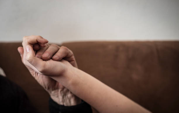 istock Grandfather and Granddaughter Holding Hands 1133157453