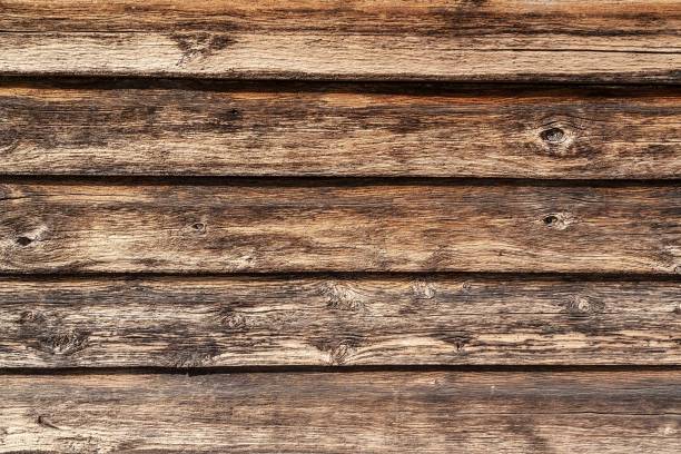 istock Horizontal weathered boards on external wall of a Australian farm shearing shed 1133157541