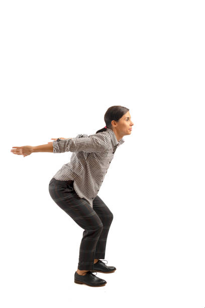 istock Young businesswoman isolated on white background doing exercises 1133158872
