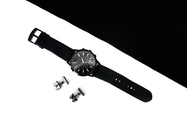 istock watches and cufflinks on the table, black and white 1133159609