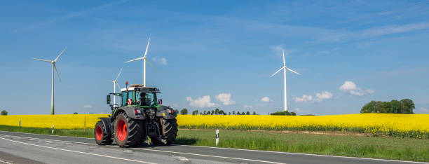 istock Agricultural panorama with Tractor 1133161145