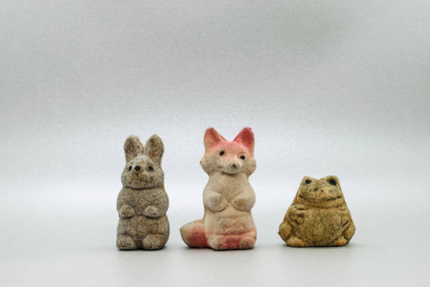 istock Very old bunny, fox and frog soft toys on grey background surface with copy space 1133161701