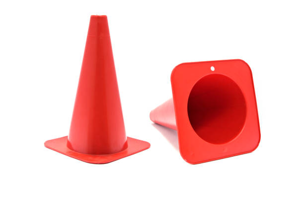 istock Road cone signal. Red plastic cone with reflective stripes isolated on white background. 1133161740