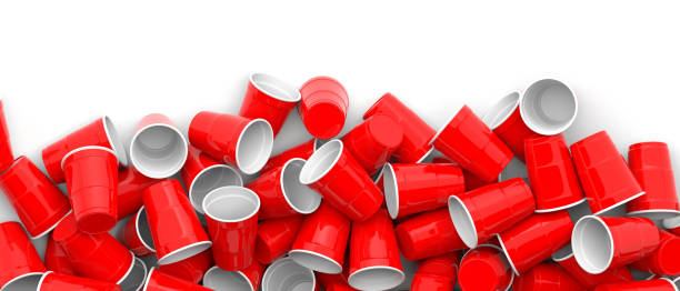 istock Plastic red color disposable cups pile on white background, banner. 3d illustration 1133161768