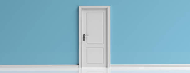 istock Closed door white on blue wall background, banner, copy space. 3d illustration 1133163229