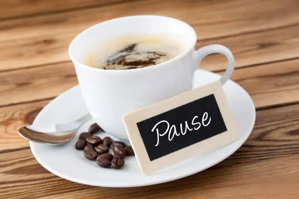 German coffee break label  against a wooden background