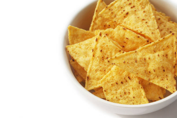 istock Corn Totillas or Nachos chips in a bowl on white 1133163631