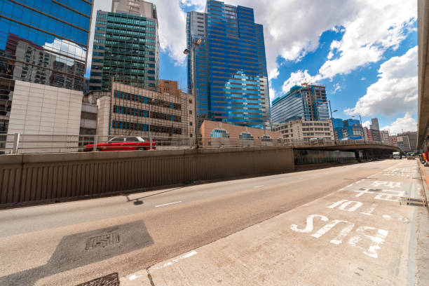 istock Tall buildings on the sky light rail and ground bus stops. 1133163887