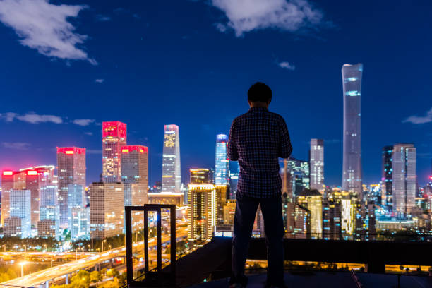 istock A man Hands holding head in Front of Modern City 1133163895