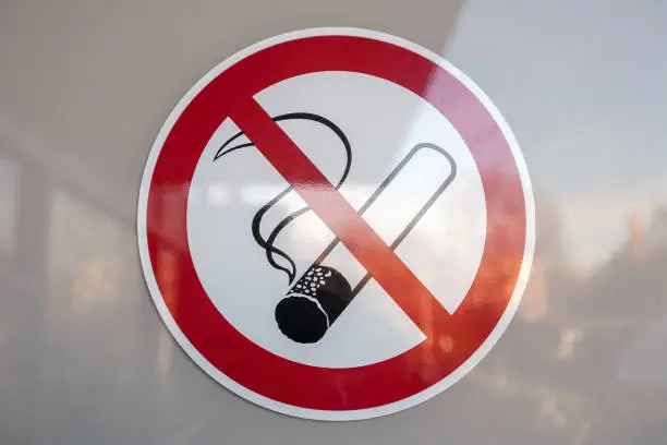 Photo of Symbol banned to smoke on white background