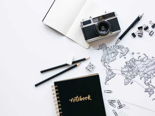 istock Business background with old, vintage camera and hand-drawn world map 1133164789