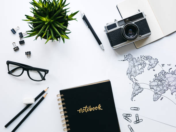 istock Business background with old, vintage camera and hand-drawn world map 1133164809