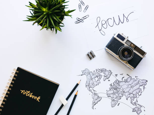 istock Business background with old, vintage camera and hand-drawn world map 1133164845