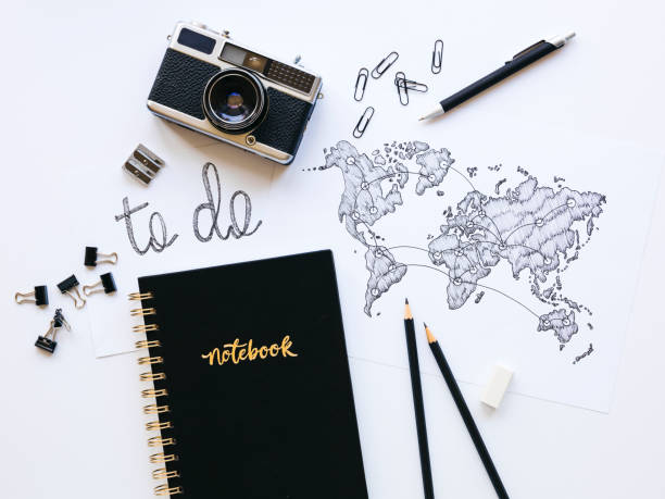 istock Business background with old, vintage camera and hand-drawn world map 1133164962