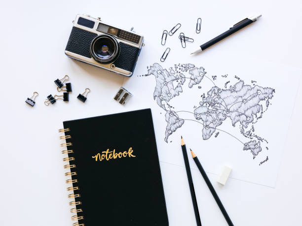 istock Business background with old, vintage camera and hand-drawn world map 1133164976
