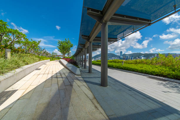 istock Glass shade corridors in modern parks under the blue sky and white clouds. 1133167915