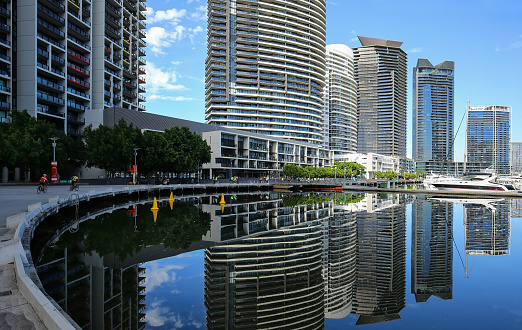 Skyscrapers reflect into the Yarra River in downtown Melbourne, Australia.