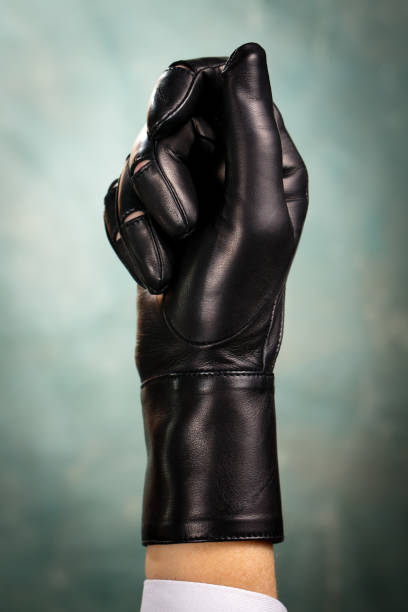 Black glove on his fist stock photo