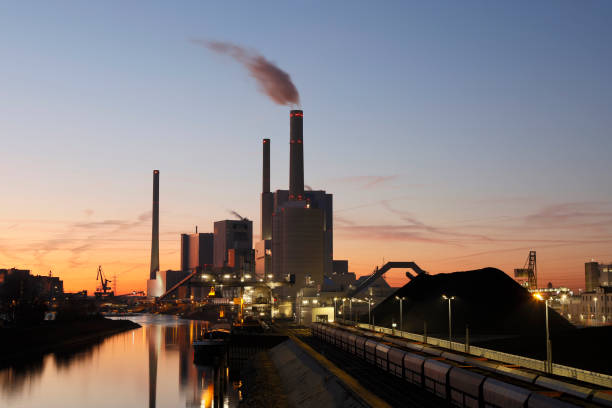 istock Coal Fired Power Station on Canal Illuminated at Dusk 1133169659