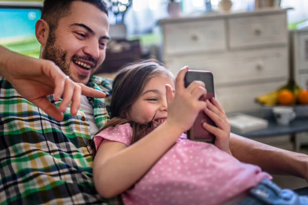 istock Family at home using smart phone 1133173403
